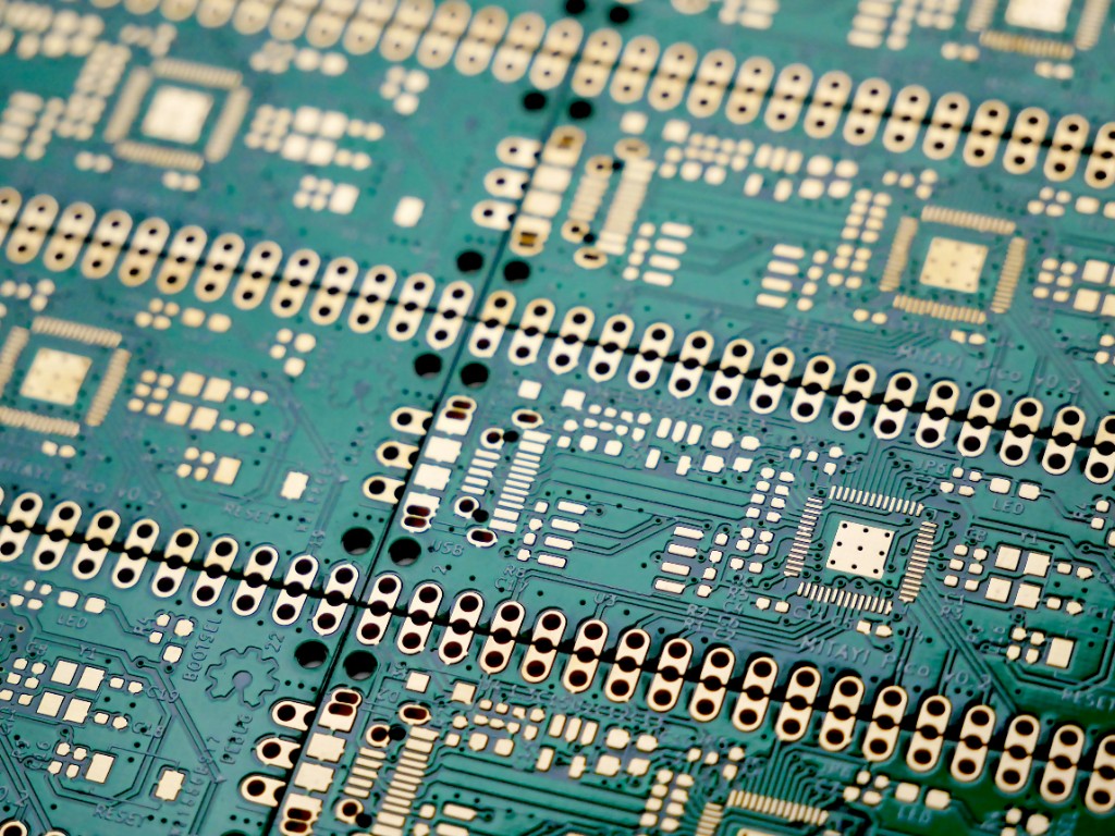 Panelized green PCBs ready for volume manufacturing